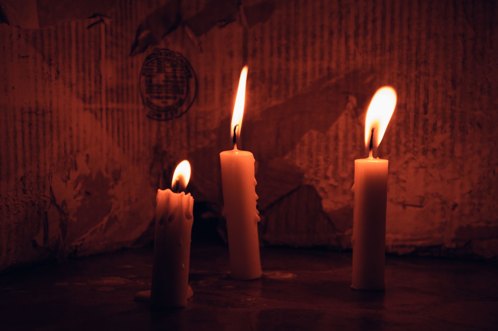 Lit candles in a dim interior